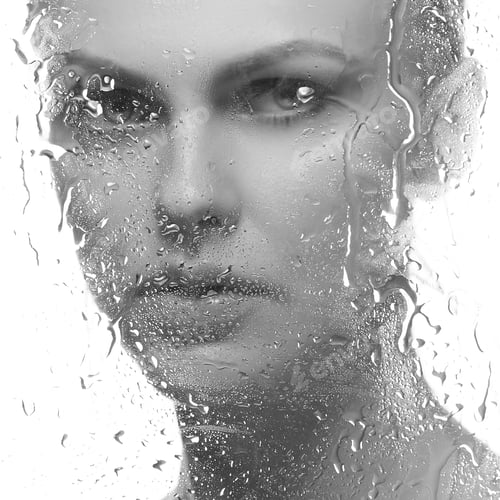 Preview: Beauty Face Of Young Caucasian Woman Near A Mirror With Water Drops. Studio Portrait. Isolated On
