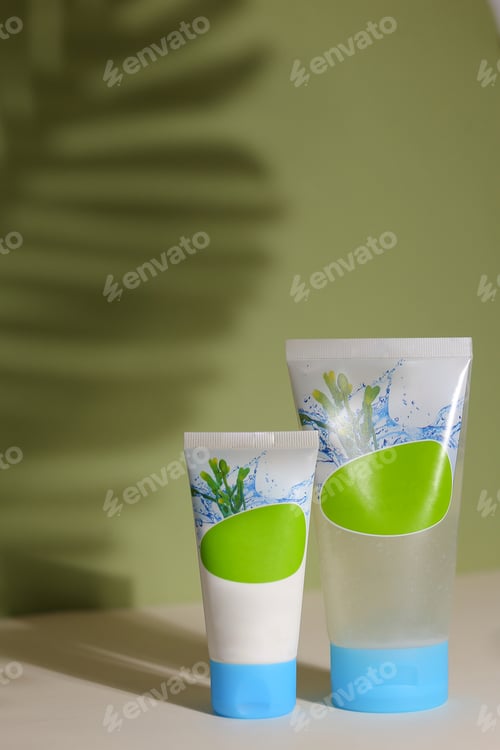 Preview: Eco Friendly Tubes With Natural Skincare Cosmetics, Creams Or Oils On Light Background. Plant-Based