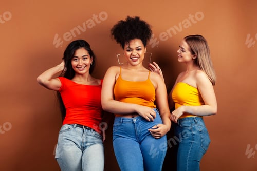 Preview: Young Pretty Multiracial Girls Posing Cheerful On Brown Background, Lifestyle People Concept