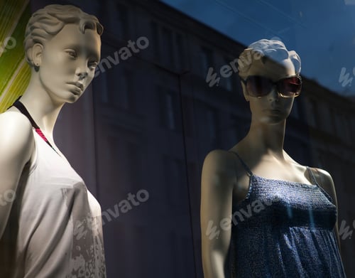Preview: Mannequins Displaying Summer Fashion in Store Window