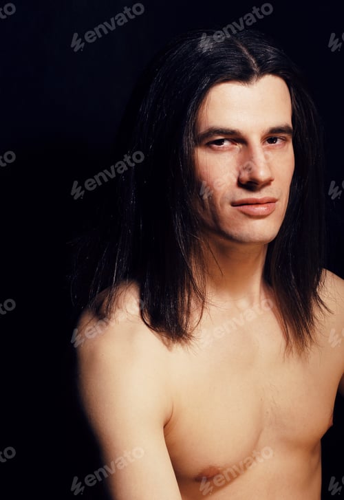 Preview: Handsome Young Man With Long Hair Naked Torso On Black Backgroun