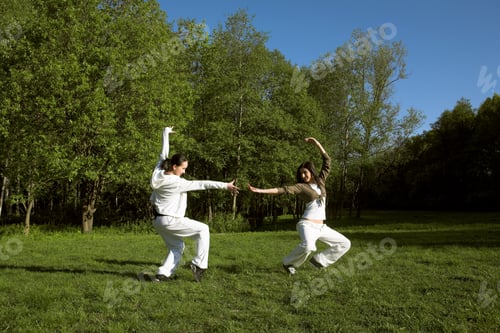 Preview: Two Girl Jumping In Park