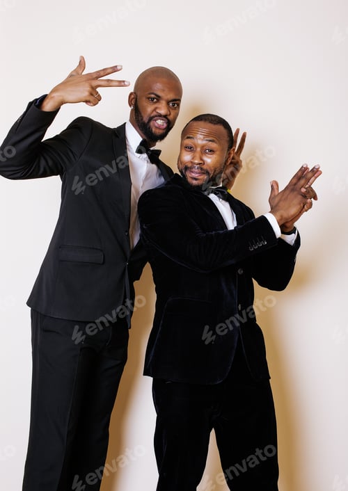 Preview: Two Afro-American Businessmen In Black Suits Emotional Posing, Gesturing, Smiling. Wearing Bow-Ties