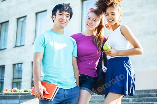 Preview: Cute Group Of Teenages At The Building Of University With Books Huggings, Diversity Nations