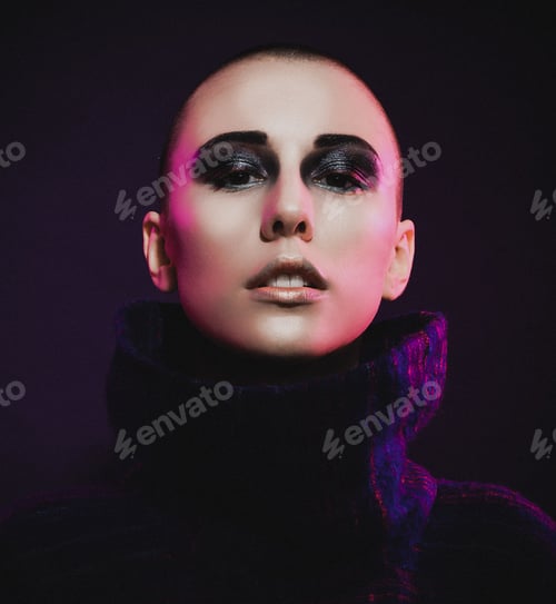 Preview: Young Fashion Model Posing In Studio. Bald. Bright Make Up.