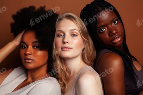 Preview: Young Pretty Caucasian, Afro, Scandinavian Woman Posing Cheerful Together On Brown Background