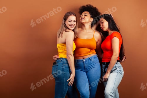 Preview: Young Pretty Multiracial Girls Posing Cheerful On Brown Background, Lifestyle People Concept