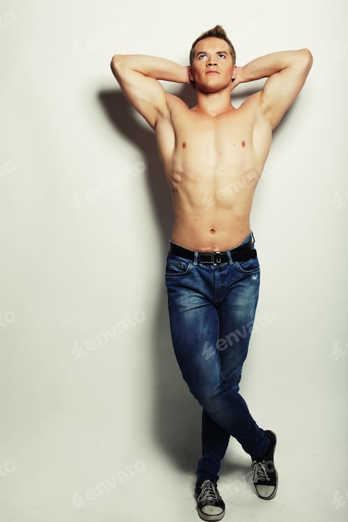 Preview: Sexy Fashion Portrait Of A Hot Male Model In Stylish Jeans With Muscular Body Posing