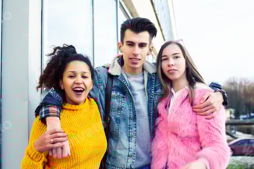 Preview: Cute Group Of Teenages At The Building Of University With Books Huggings, Diversity Nations Real