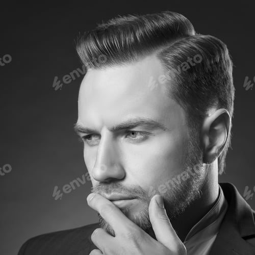 Preview: Young Handsome Thoughtful Bearded Caucasian Man With Blue Eyes And A Hand Near Chin. Perfect Skin