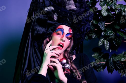 Preview: Fashion, Beauty, People And Halloween Concept: Young Woman With A Bright Creative Make-Up And A Big