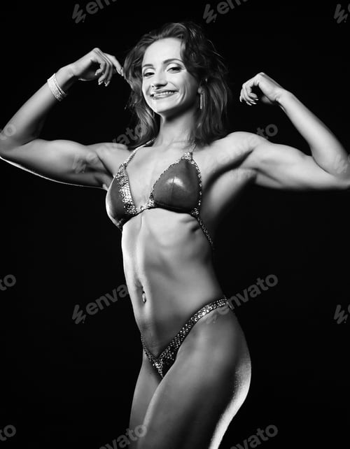 Preview: A Beautiful Woman Bodybuilder Posing In Green Bikini