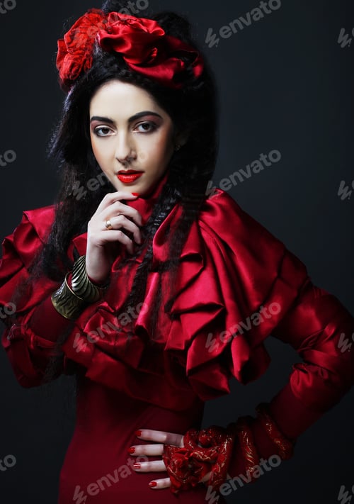 Preview: Glamour Fashion Model In Elegance Red Costume With Red Hat. Studio Shot.