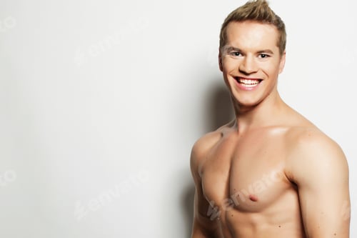 Preview: Sexy Fashion Portrait Of A Hot Male Model In Stylish Jeans With Muscular Body Posing