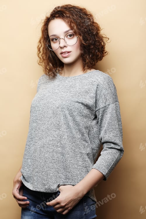Preview: Positive Female Student Wears Grey Sweater, Round Glasses.People, Studying, Success And