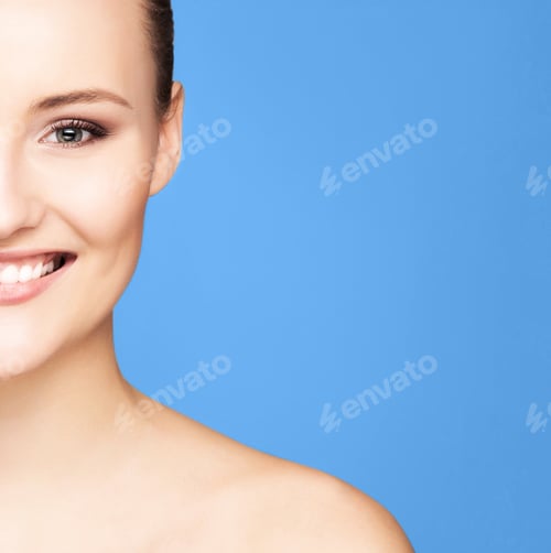 Preview: Portrait Of A Young Woman Over Blue Background