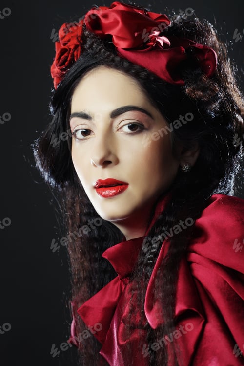Preview: Glamour Fashion Model In Elegance Red Costume With Red Hat. Studio Shot.