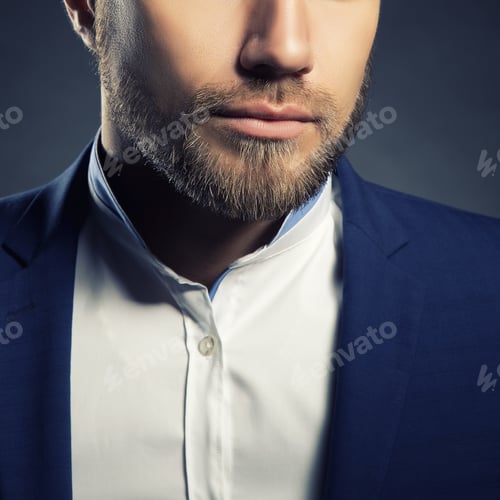 Preview: Portrait Of Handsome Stylish Caucasian Young Man In Elegant Blue Suit With Perfect Hair Style. Toned