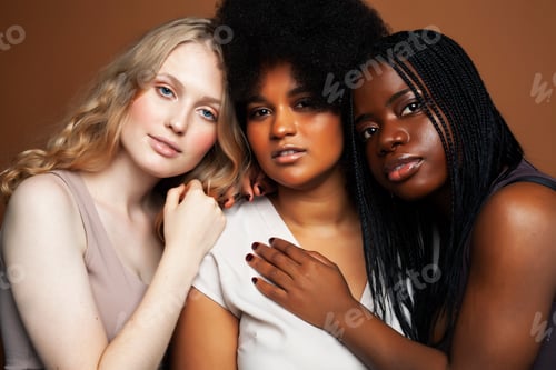 Preview: Young Pretty African And Caucasian Women Posing Cheerful Together On Brown Background, Lifestyle