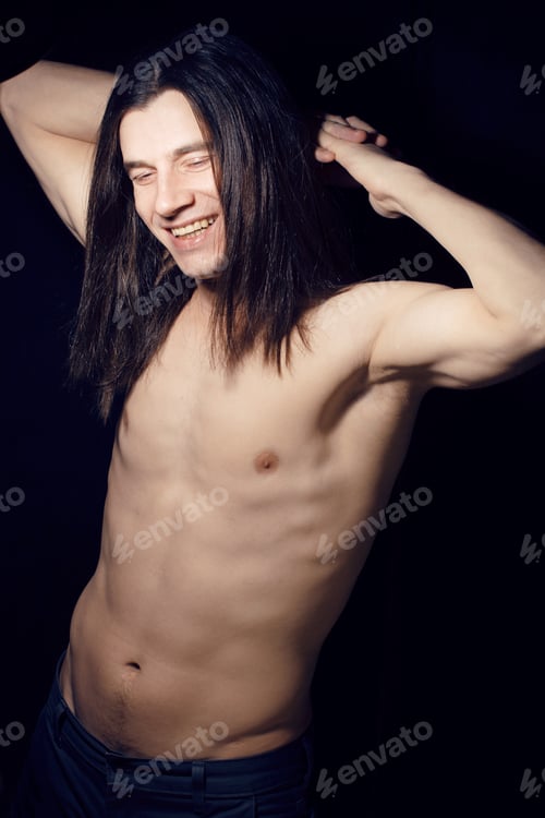 Preview: Handsome Young Man With Long Hair Naked Torso On Black Background Smiling, Lifestyle People Concept