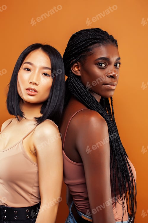Preview: Young Pretty Asian, Afro Woman Posing Cheerful Together On Brown Background, Lifestyle Diverse