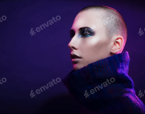 Preview: Young Fashion Model Posing In Studio. Bald. Bright Make Up.