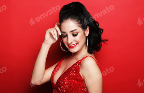 Preview: Lifestyle, Party And People Concept - Luxury Woman In Evening Dress Posing Over Red Background