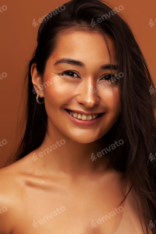 Preview: Young Pretty Asian Woman Cheerful Smiling Posing On Warm Brown Background, Lifestyle People Concept