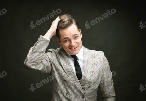 Preview: Young Man Model Posing Over Dark Background