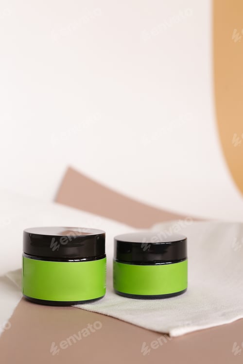 Preview: Focus On Two Jars Of Facial Cosmetic Cream With Green Space For Brand. Concept Of Cluelty Free