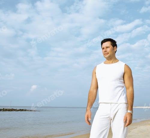 Preview: Young Brunette Man On Beach At Sea Smiling, Gomosexual In White
