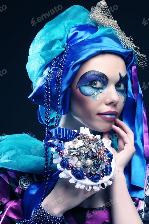 Preview: Young Woman With Creative Make Up Holding A Bouquet Of Jewelry