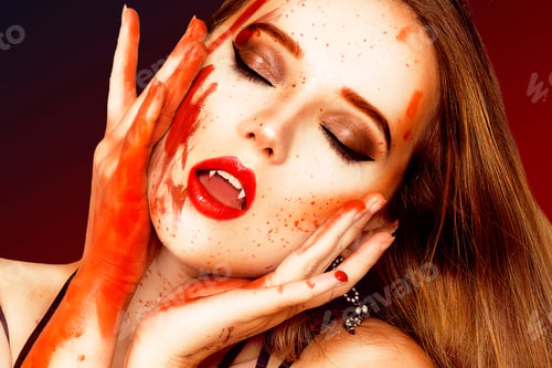Preview: Sexy Vampire Woman With Blood On Her Face. Beautiful Halloween Vampire Woman Portrait. Beauty Lady