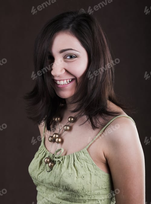 Preview: Young Pretty Woman In Green Dress