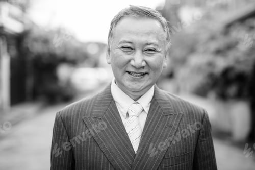 Preview: Mature Asian Businessman In The Streets Outdoors