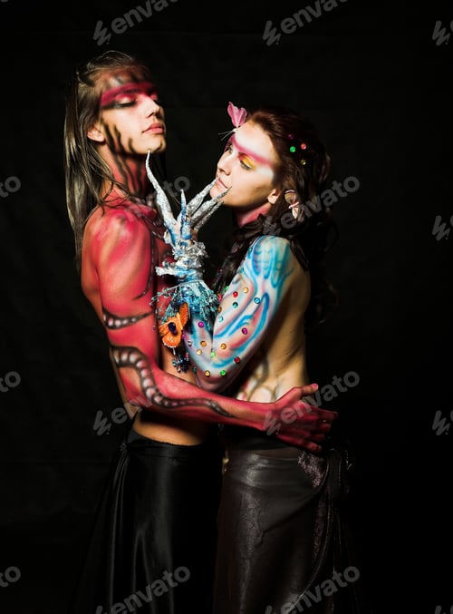 Preview: Close-Up Portrait Of A Loving Couple With Paint On Their Bodies. Studio Shot, Isolated On Black