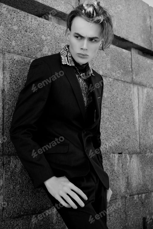Preview: Handsome Fashion Male Model Dressed In Elegant Suit Posing Outdooe. Long Haired Metrosexual. Black