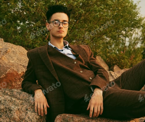 Preview: Elegant Young Handsome Man. Outdoors Fashion Portrait. Man With Glasses.