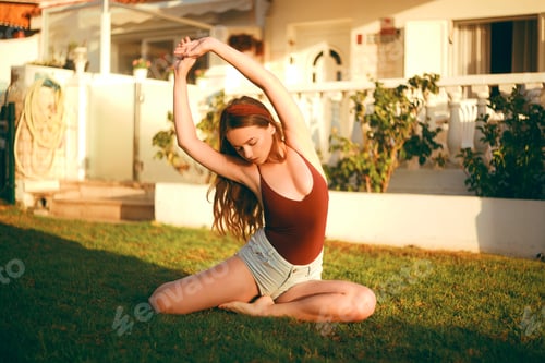 Preview: The Girl Does Yoga, Does Exercises, Does Sports On The Lawn Near Her House. Girl In The Early