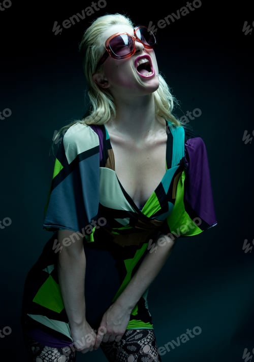 Preview: Young Woman With Sunglasses On Black Background