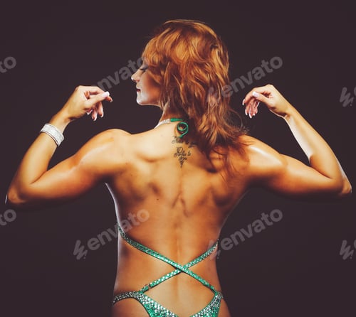 Preview: Athletic Young Woman Showing Muscles