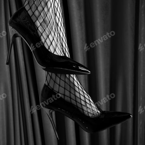Preview: Elegant Black Heels and Fishnet Stockings