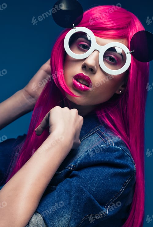Preview: People And Fashion Concept: Fashion Model With Pink Hair And Big Sunglasses Over Blue Background