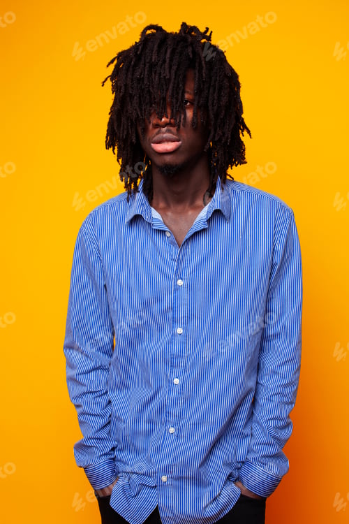 Preview: Young Handsome African American Guy Student Posing Cheerful And Gesturing On Yellow Background