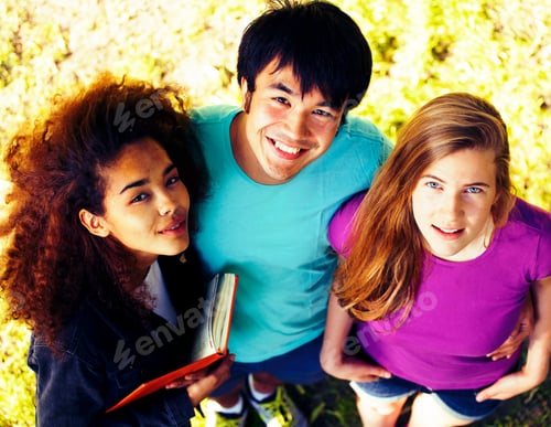 Preview: Cute Group Of Teenages At The Building Of University With Books Huggings, Diversity Nations