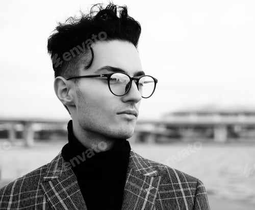 Preview: Elegant Young Handsome Man. Outdoors Fashion Portrait. Man With Glasses.Black And White Picture.