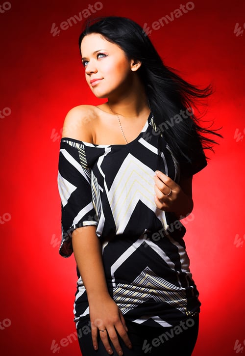 Preview: Portrait Of Beautiful Young Sexy Woman On Red Background