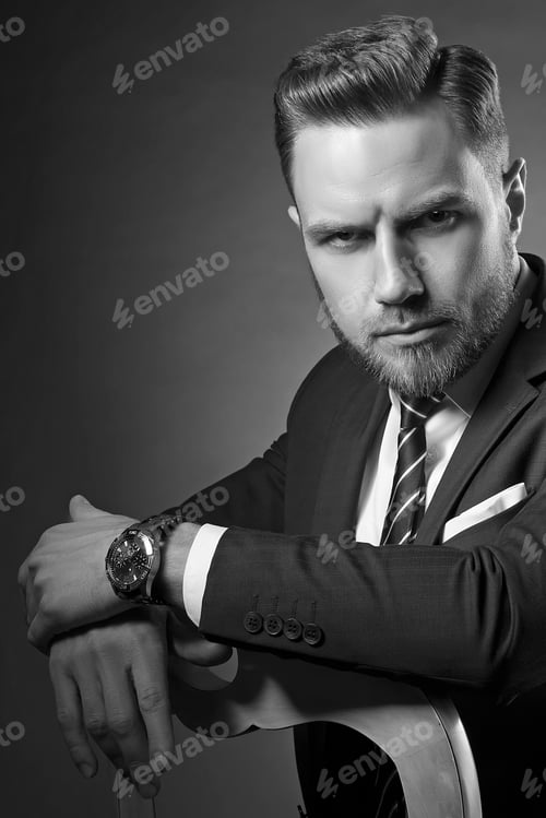 Preview: Young Handsome Bearded Caucasian Man With Blue Eyes Sitting On Chair. Perfect Skin And Hairstyle