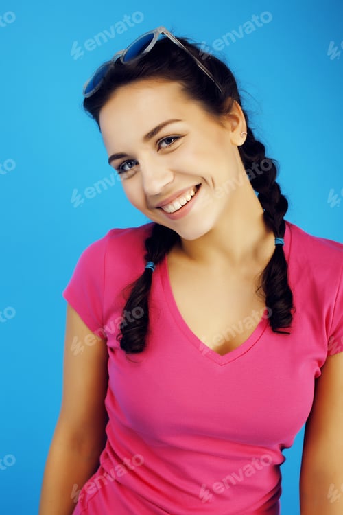 Preview: Young Pretty Teenage Hipster Girl Posing Emotional Happy Smiling On Blue Background, Lifestyle