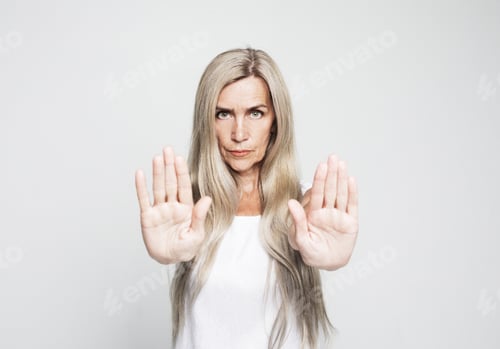 Preview: Lifestyle And Emotion Concept: Senior Grey-Haired Woman Doing Stop Sign With Serious And Confident
